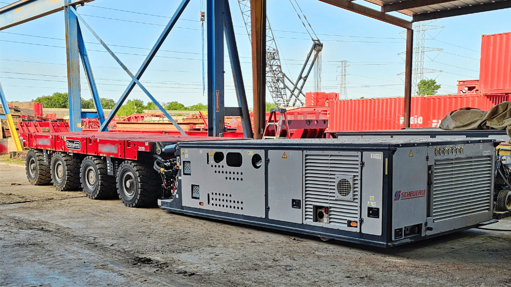 Red heavy Haul trailer at a jobsite